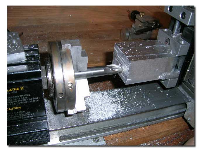 it up in the milling attachement to have flat square surfaces to grip in the 4-jaw chuck.